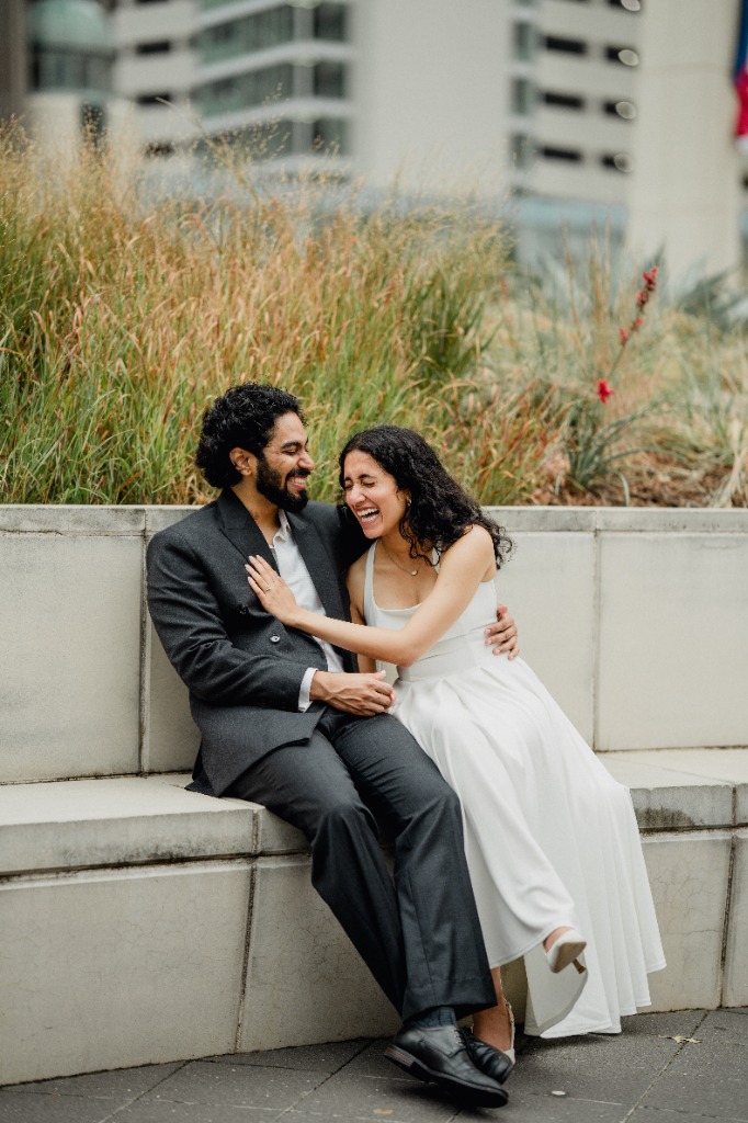 Sitting together laughing outdoors